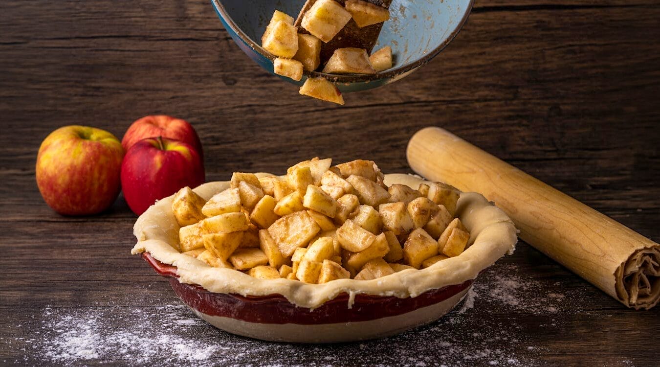 Pouring applies into a pie dish before baking.