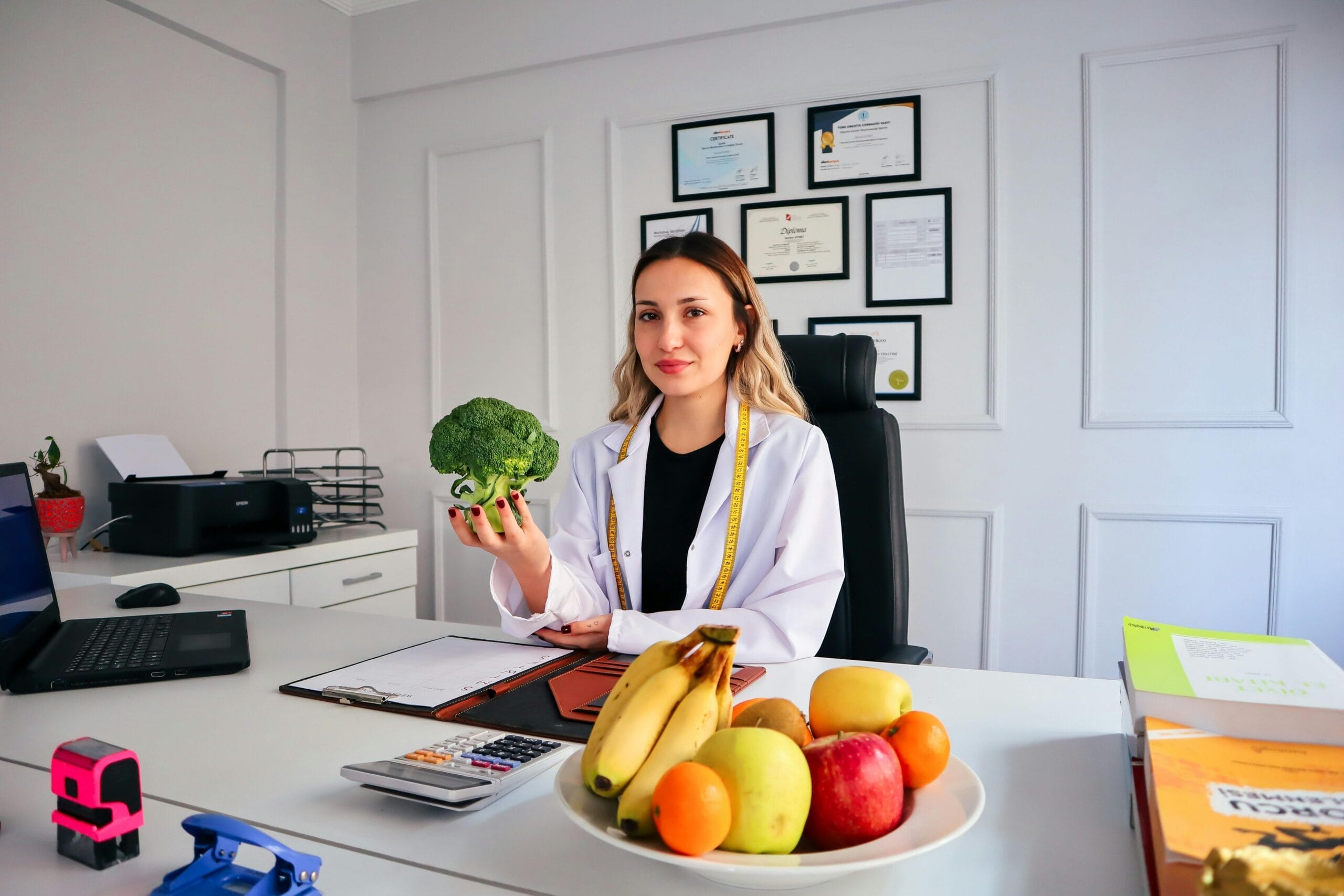 A Registered Dietitian sitting at her desk.