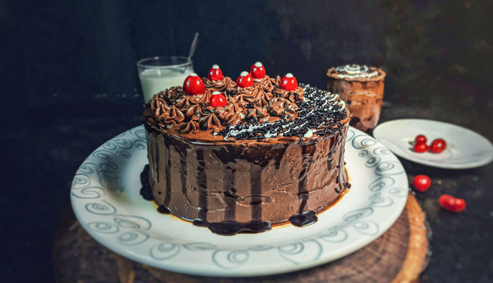 A Black Forest Cake getting ready to be sliced.
