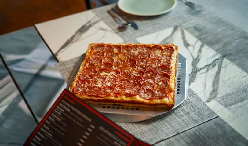 Deep dish pizza on a table