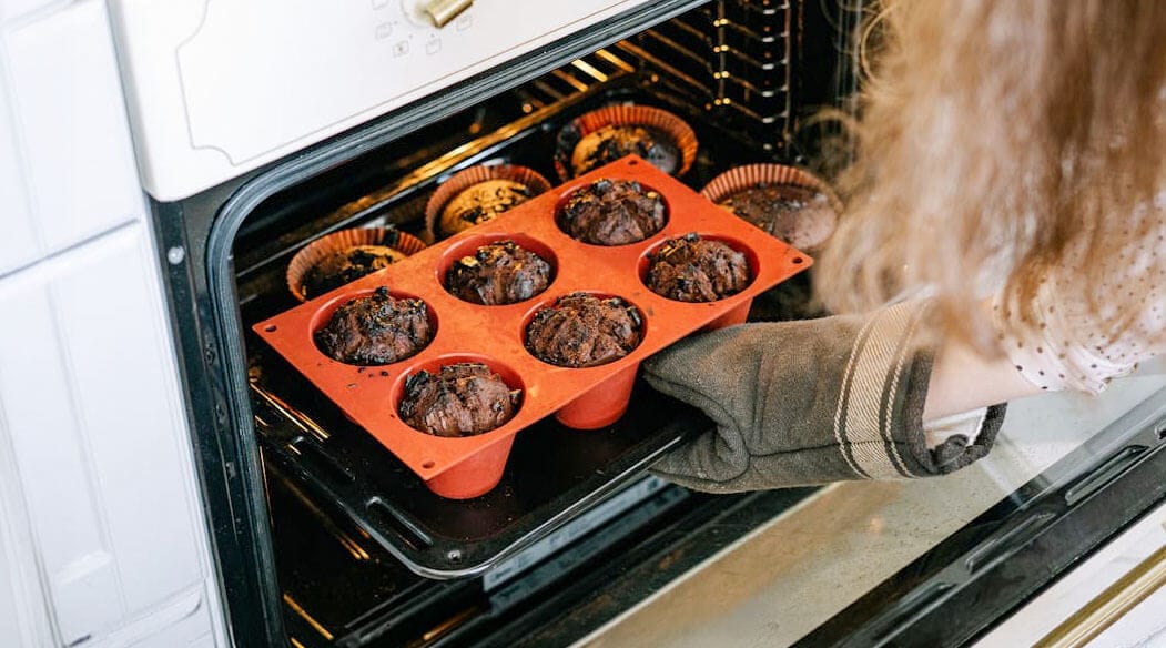 Baking muffins in the oven.