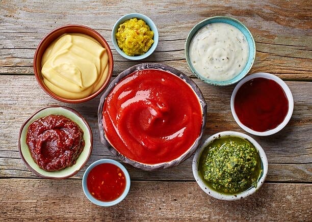 Multiple sauces in little bowls.
